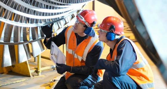 Two engineers inspecting an installation