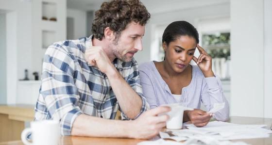 Couple looking at their bills