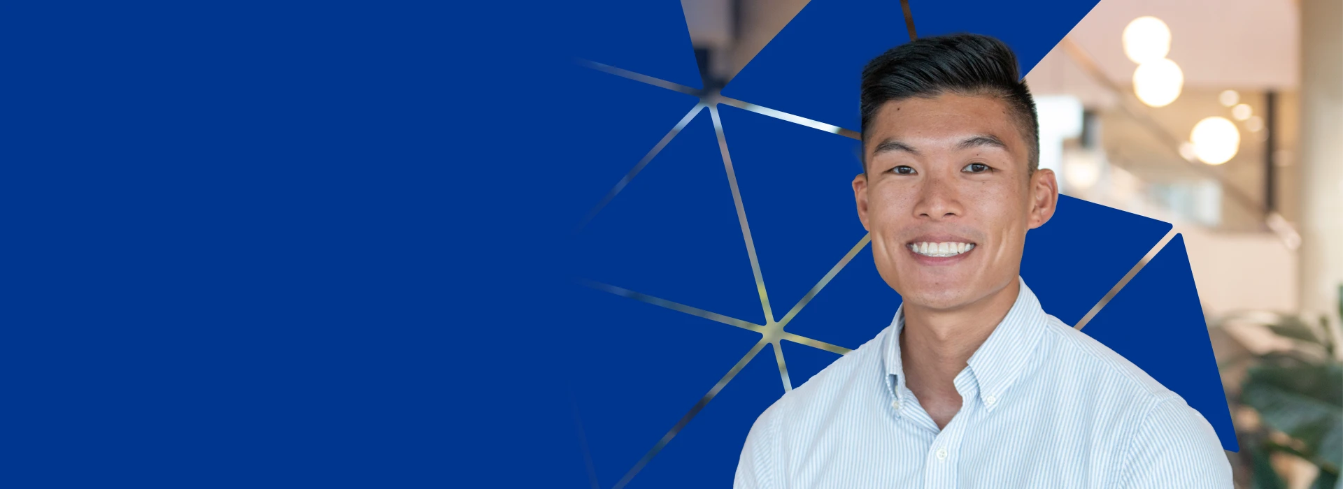 Male employee with logo background