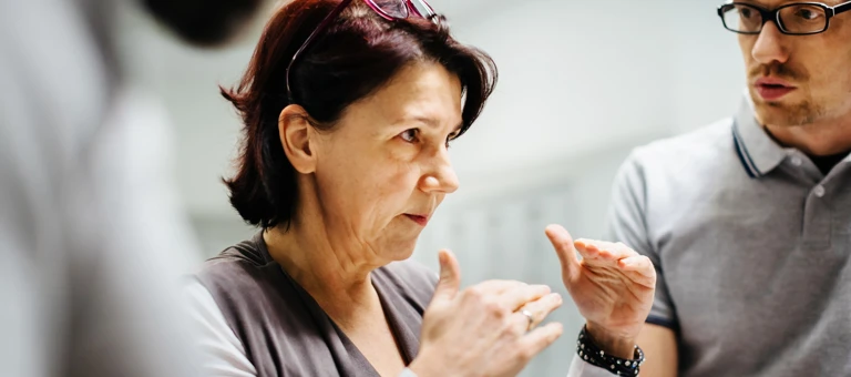 Woman in a meeting giving an explanation