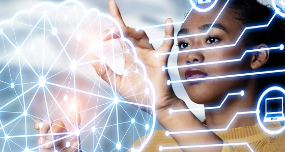 A woman touching holographic image of brain surrounded by icons