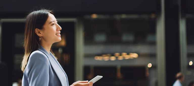 Woman walking with a smartphone