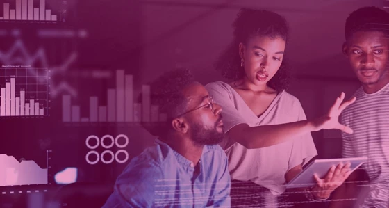 Three people in conversation with digital graphs overlay