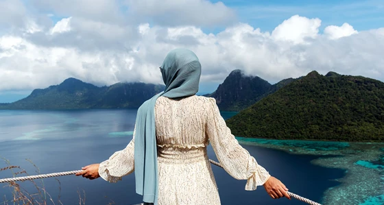Woman Looking Over Beautiful View of an Ocean in Bohey Dulang