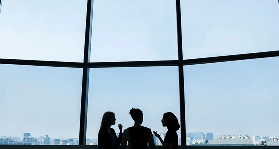 Group of women having a conversation in an office